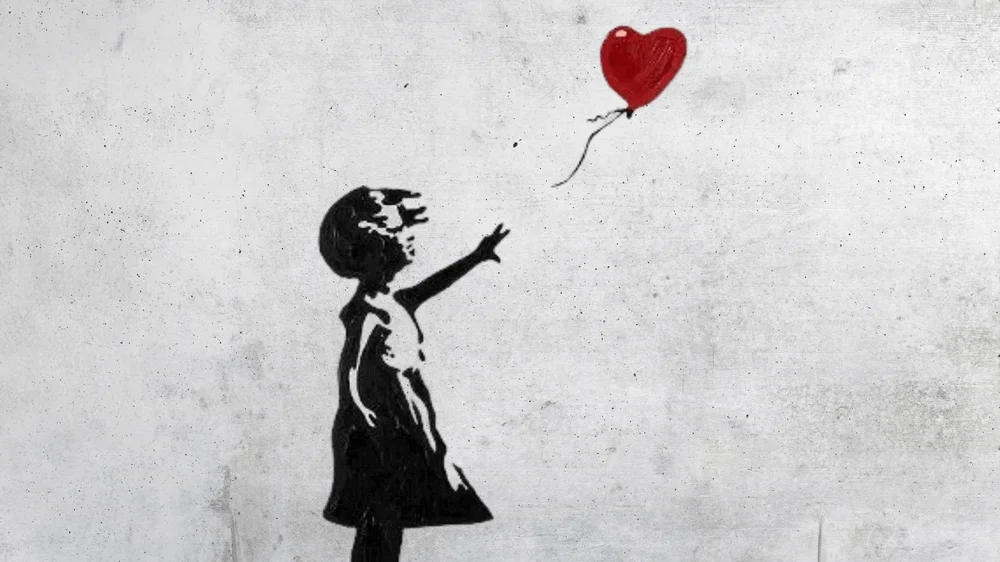 Banksys-graffiti-girl-with-balloon
